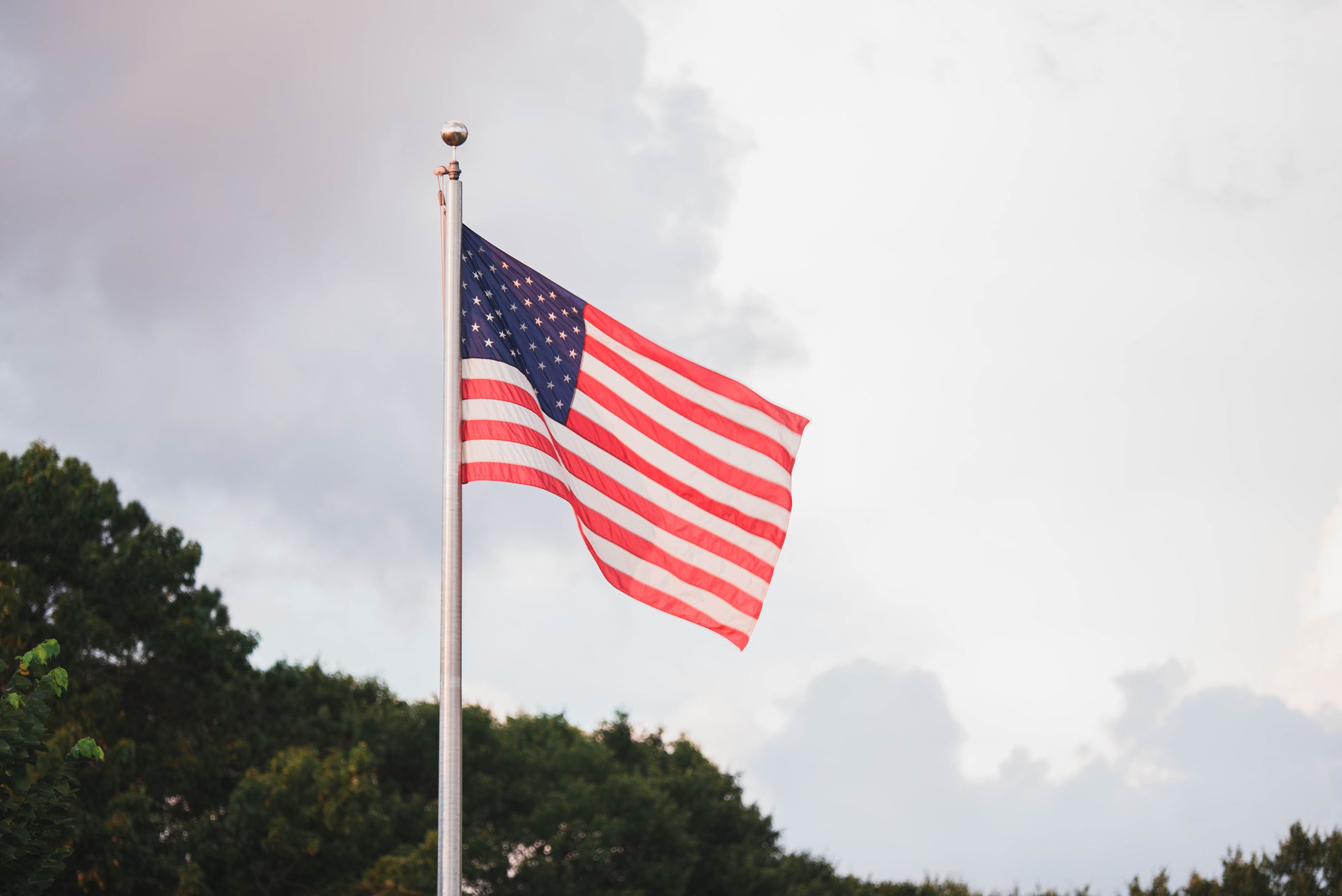American flag on pole post