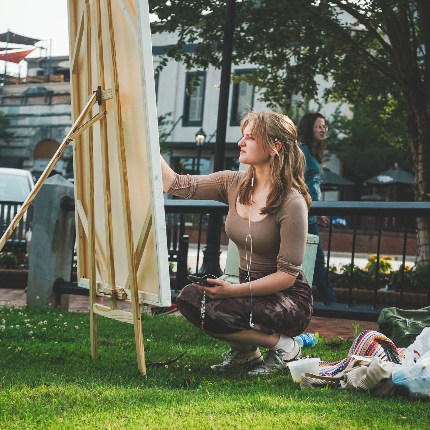 Student live painting on the Courthouse lawn