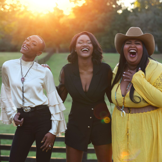 Chapel Hart promo of three women in a field 
